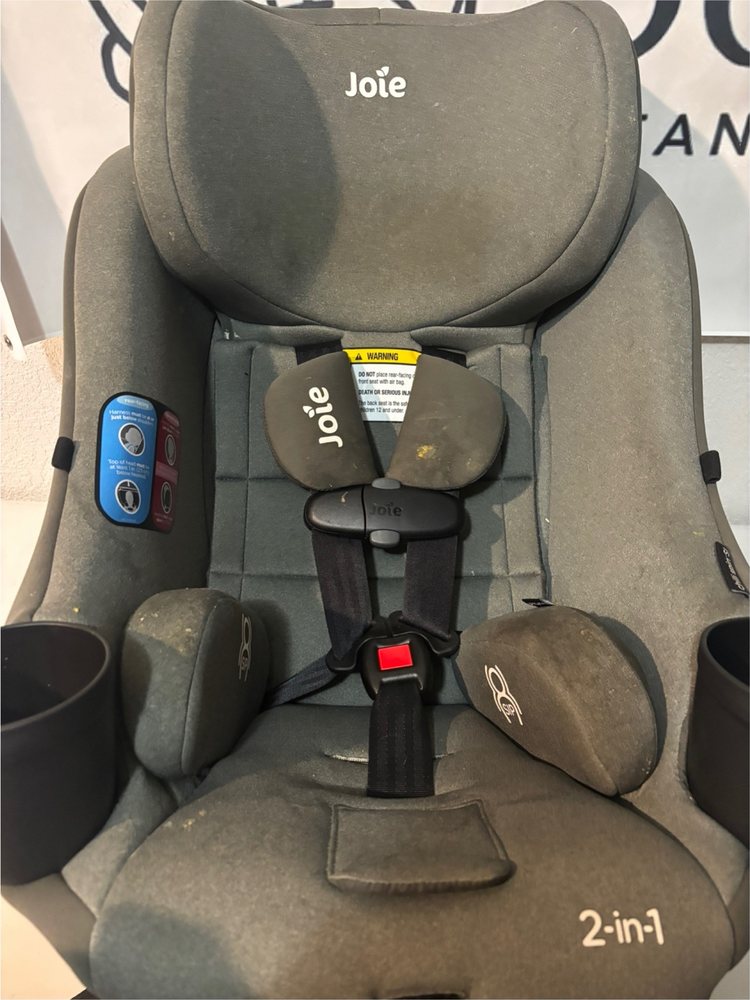Gray Joie car seat before cleaning, with crumbs and stains